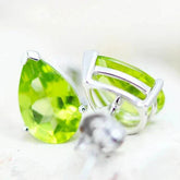 Natural Peridot Pear Earrings in 14K white gold with faceted green gemstones