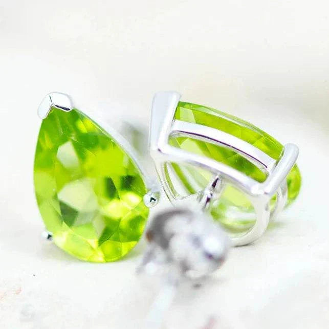 Natural Peridot Pear Earrings in 14K white gold with faceted green gemstones