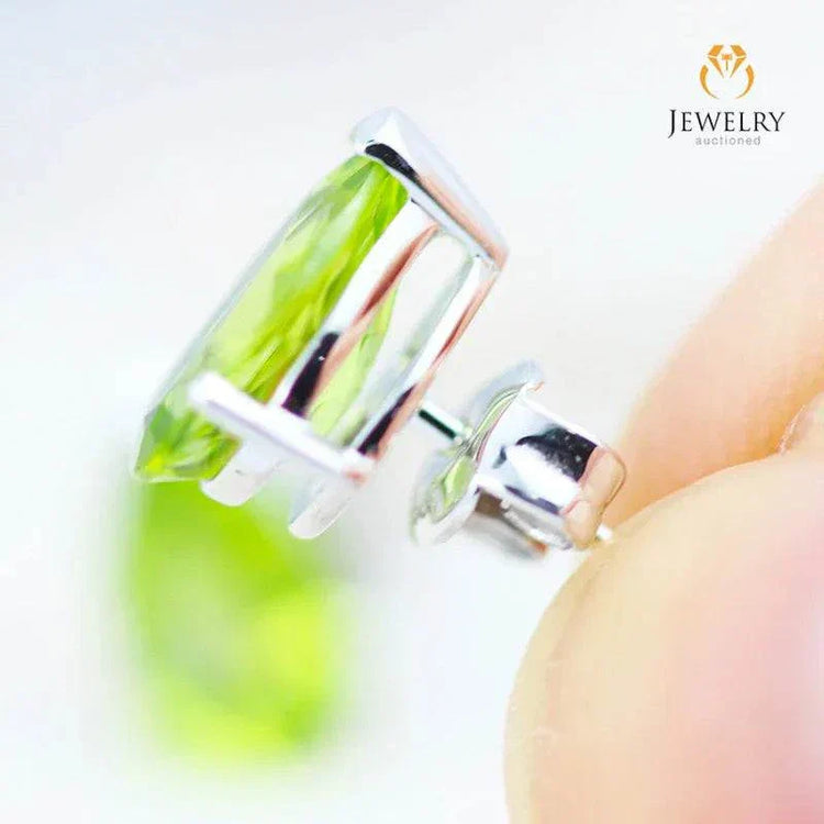 Natural peridot pear earrings set in 14K white gold with faceted gemstones