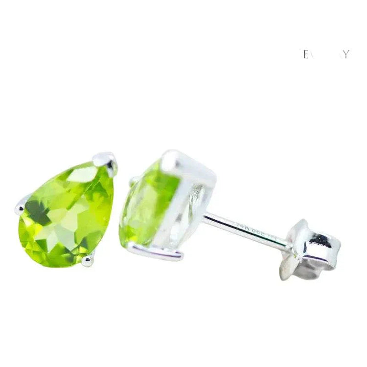 Natural peridot pear earrings set in 14K white gold with faceted green gemstones