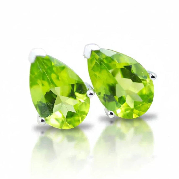 Natural peridot pear earrings in 14K white gold with faceted gemstones and elegant design
