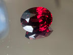 Certified 14.06 Ct Vivid Red Garnet with Pink Hue – Untreated, VS Clarity, Fancy Oval Cut – Ideal for High-End Jewelry or Collectors - GAIA GEMS